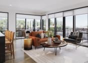Thumbnail 31 of 58 - a living room with a brown couch and a table at Bemiston Place Apartments, Clayton