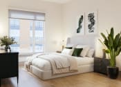 Thumbnail 49 of 58 - a bedroom with a white bed and a large window at Bemiston Place Apartments, Clayton, MO