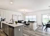 Thumbnail 3 of 20 - Kitchen and living room area at The Willows, O'Fallon, MO, 63367