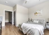 Thumbnail 24 of 28 - a bedroom with a bed and a closet at The Junction at Rogers, Rogers, 72756