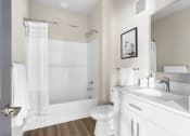 Thumbnail 27 of 28 - a bathroom with a sink and a toilet and a shower at The Junction at Rogers, Rogers, Arkansas