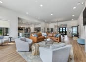 Thumbnail 29 of 33 - Modern clubroom with conversational seating at The Prairie Villas, Dardenne Prairie, 63368