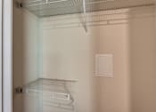 Thumbnail 11 of 32 - Empty shelves in a white refrigerator.