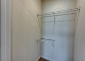 Thumbnail 19 of 32 - Empty wire shelving in a corner of a room.