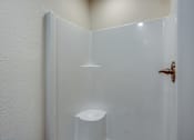 Thumbnail 28 of 32 - A white door with a brass handle and a white light on the wall.