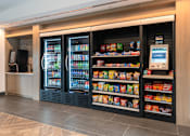 Thumbnail 43 of 46 - A vending machine with a variety of snacks and drinks.