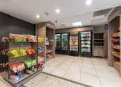 Thumbnail 30 of 42 - a convenience store with a large selection of food and drinks on display at Clayton On The Park, Clayton, MO