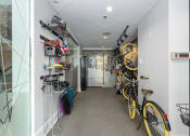 Thumbnail 37 of 42 - a room with bikes on the wall and a door at Clayton On The Park, Clayton, Missouri