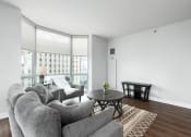 Thumbnail 8 of 42 - a living room with a couch and a coffee table at Clayton On The Park, Clayton