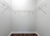Thumbnail 5 of 42 - room with white walls and a white closet with wire shelving on top of it at Clayton On The Park, Clayton, MO