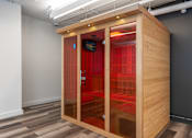Thumbnail 31 of 46 - A wooden pod with a red interior is open in a room.