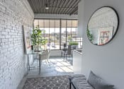 Thumbnail 31 of 39 - Steelcote Crossing entry way with exposed white brick wall, oversized windows and concrete flooring at Steelcote Square, Missouri, 63103