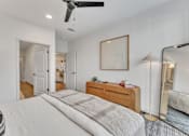 Thumbnail 25 of 37 - Bedroom with ceiling fan at Plaza at Pinnacle Hills, Rogers, Arkansas