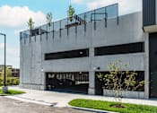 Thumbnail 17 of 39 - Steelcote Flats exterior gated garage parking at Steelcote Square, Missouri