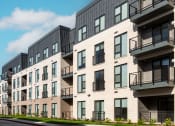 Thumbnail 43 of 71 - modern apartment buildings on a city street at The Flats & Terraces at Wildhorse Village, Missouri, 63005