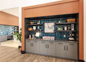 Thumbnail 13 of 28 - A kitchen with a wooden floor and a wall with a shelf at Montage at Hawk Ridge Apartments, Lake St. Louis, Missouri