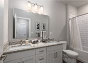 Thumbnail 8 of 28 - A bathroom with a white toilet, sink, and a white shower curtain at Hawk Ridge Apartments, MO 63367