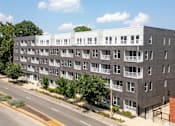 Thumbnail 45 of 47 - an aerial view of an apartment building on a city street at Grand Flats, St. Louis, MO