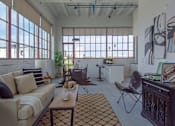 Thumbnail 34 of 39 - Steelcote Lofts living room with polished concrete flooring at Steelcote Square, St. Louis