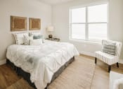 Thumbnail 8 of 19 - a bedroom with a bed and a window at 44 West Luxury Living, Valley Park, Missouri