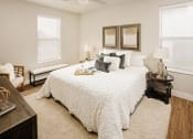 Thumbnail 6 of 19 - a bedroom with a large bed and two windows at 44 West Luxury Living, Valley Park, MO, 63088