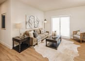 Thumbnail 5 of 19 - a living room with a couch and a table at 44 West Luxury Living, Missouri, 63088