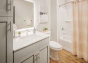 Thumbnail 9 of 19 - a bathroom with a sink and a toilet and a shower at 44 West Luxury Living, Missouri, 63088