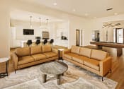 Thumbnail 15 of 19 - a large living room with couches and at 44 West Luxury Living, Missouri