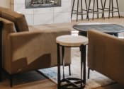 Thumbnail 17 of 19 - a living room with a fireplace and chairs and tables at 44 West Luxury Living, Valley Park, 63088