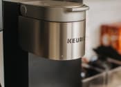 Thumbnail 19 of 19 - a keurig coffee maker on a kitchen counter at 44 West Luxury Living, Valley Park, MO