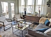 Thumbnail 1 of 23 - a living room filled with furniture and a glass table at GrandView Flats and Townhomes, Indiana