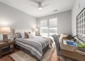 Thumbnail 49 of 71 - a bedroom with a large bed and a window at The Flats & Terraces at Wildhorse Village, Missouri, 63005