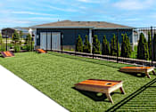 Thumbnail 30 of 34 - A backyard with a lawn, a fence, and a shed.