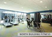 Thumbnail 17 of 21 - a spacious fitness room with cardio machines and weights  at Expo at Forest Park, St. Louis, MO