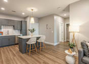 Thumbnail 1 of 66 - A modern kitchen with a dining area and a living area.at Preserve at Sycamore Creek, Osage Beach