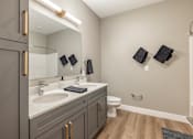 Thumbnail 9 of 66 - A bathroom with a sink, toilet, and mirror.at Preserve at Sycamore Creek, Missouri 65065