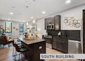 Thumbnail 9 of 21 - a kitchen and living room in a south building  at Expo at Forest Park, St. Louis
