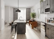 Thumbnail 2 of 6 - A modern kitchen with a large island in the center at Mila Apartments, Ellisville, MO, 63011