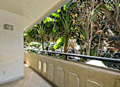 Thumbnail 43 of 56 - A balcony with a railing and a wall with a small plaque on it.