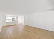 Thumbnail 45 of 56 - A room with wooden floors and white walls.