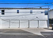 Thumbnail 3 of 3 - A white building with the letters "LL" on it.