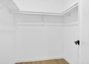 Thumbnail 8 of 12 - an empty room with white walls and a black door