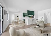 Thumbnail 15 of 29 - A modern living room with a white sofa and a green cabinet.