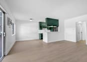 Thumbnail 19 of 29 - A room with a white wall and a green cabinet.