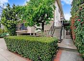 Thumbnail 19 of 21 - A house with a tree in front of it.