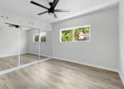 Thumbnail 13 of 47 - an empty room with sliding glass doors and a window