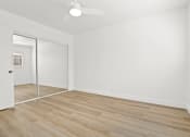 Thumbnail 7 of 39 - an empty room with white walls and a sliding glass door