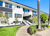 Thumbnail 1 of 2 - A white building with the number 7941 on it.