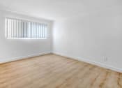 Thumbnail 4 of 17 - an empty room with white walls and a window