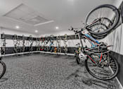 Thumbnail 21 of 39 - A bike shop with many bikes hanging on the wall.